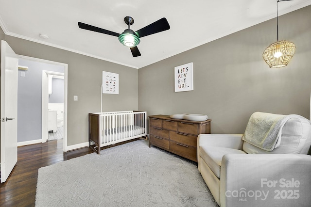 bedroom featuring wood-type flooring, ornamental molding, and ceiling fan