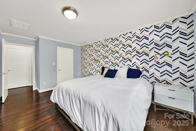 bedroom featuring dark wood-type flooring and ornamental molding