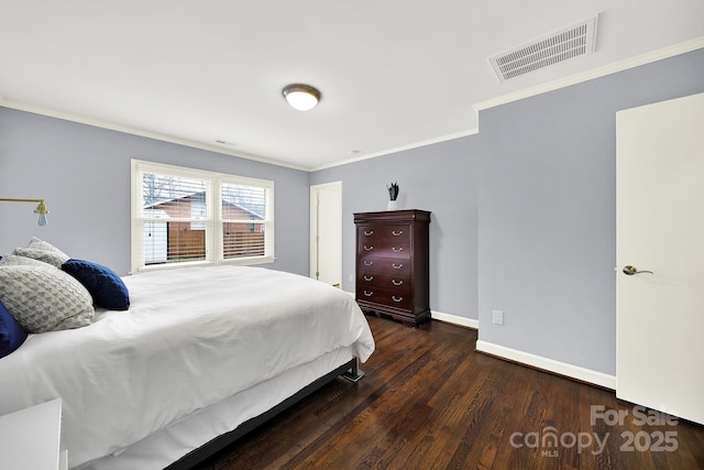 bedroom with dark hardwood / wood-style flooring and ornamental molding