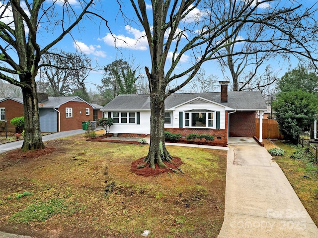 ranch-style house with a carport and a front yard