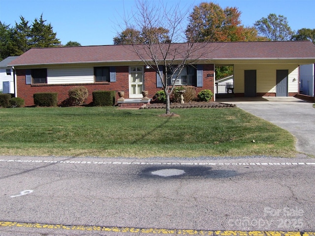 single story home featuring a carport and a front lawn