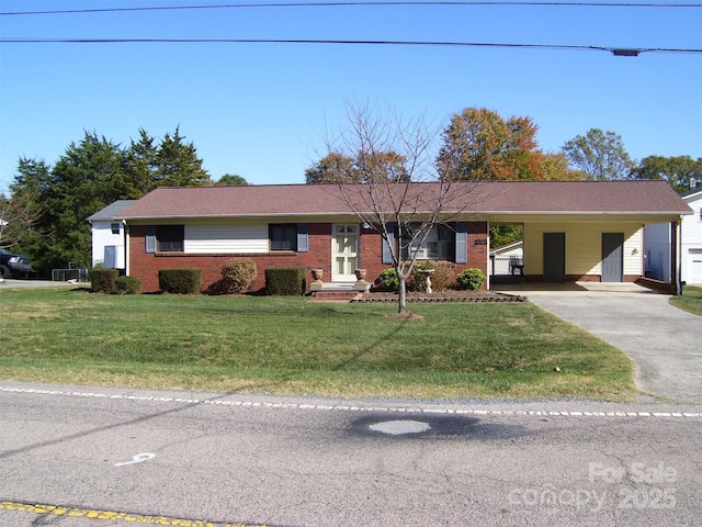 ranch-style house featuring a carport and a front yard