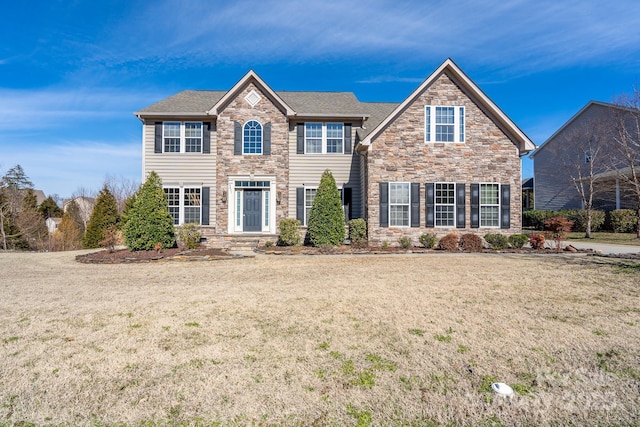 view of front facade featuring a front yard