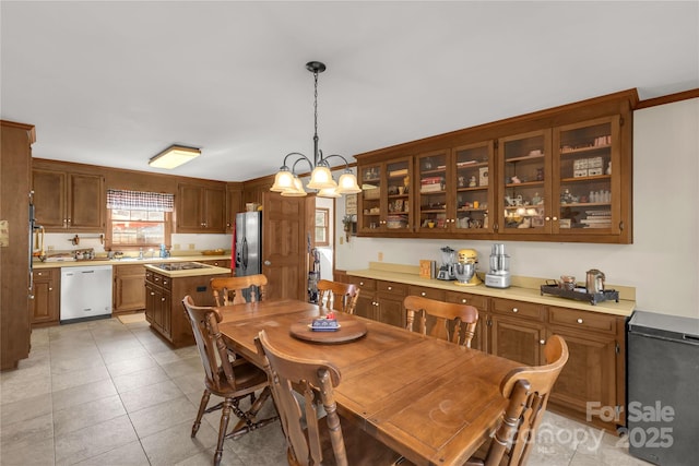 dining space featuring light tile patterned floors