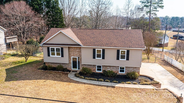 bi-level home featuring a front yard