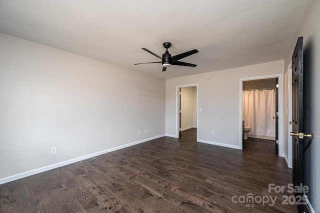 unfurnished bedroom with dark hardwood / wood-style flooring, ceiling fan, and ensuite bathroom