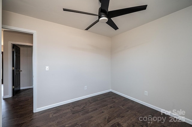 unfurnished room featuring ceiling fan and dark hardwood / wood-style flooring