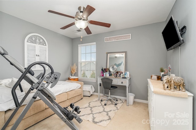 bedroom with light carpet, ceiling fan, and baseboards