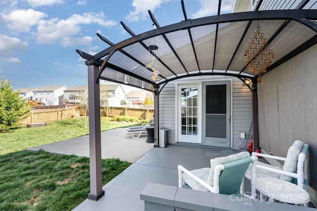 view of patio featuring fence and a pergola