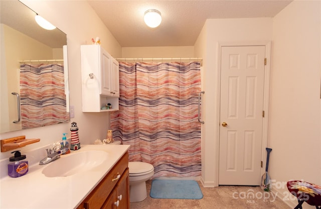 bathroom with vanity, toilet, a shower with shower curtain, and a textured ceiling