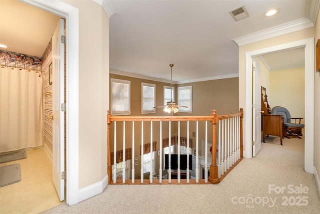 hallway with ornamental molding, carpet, visible vents, and recessed lighting