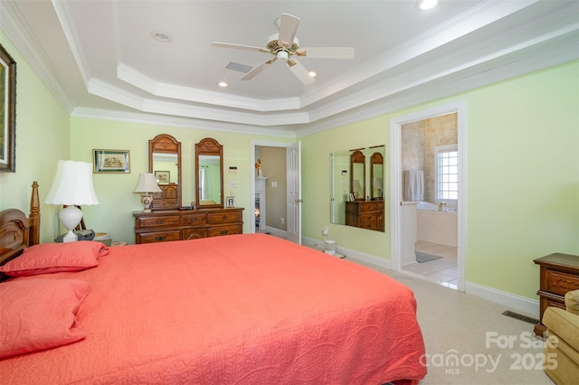 carpeted bedroom with crown molding, recessed lighting, a raised ceiling, visible vents, and baseboards