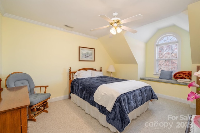 bedroom featuring vaulted ceiling, crown molding, carpet flooring, and baseboards