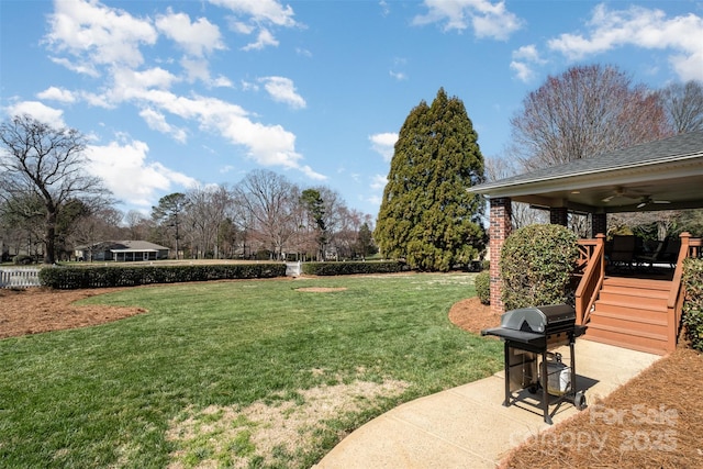 view of yard featuring ceiling fan