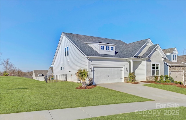 view of front of property with stone siding, roof with shingles, concrete driveway, and a front lawn