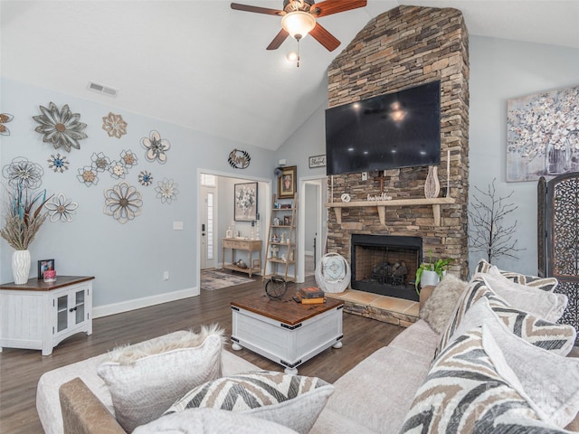 living room with ceiling fan, a fireplace, dark hardwood / wood-style flooring, and high vaulted ceiling