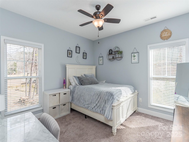 bedroom with ceiling fan and light colored carpet