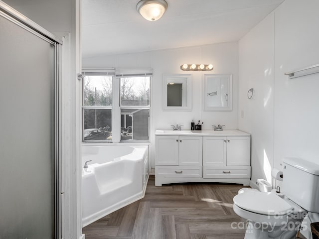 full bathroom featuring vanity, parquet floors, toilet, and separate shower and tub