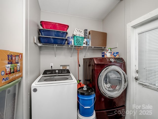 washroom with washing machine and dryer