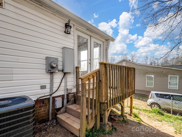 view of exterior entry featuring central AC unit