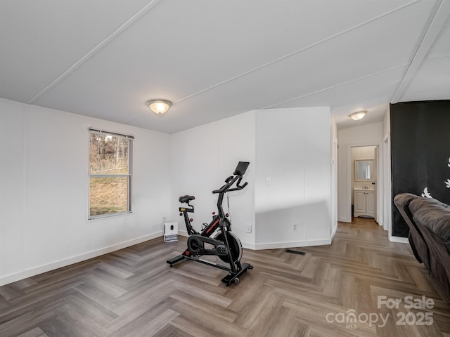 exercise area featuring light parquet floors