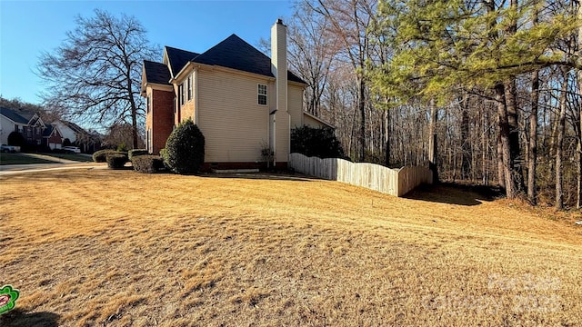 view of home's exterior with a lawn