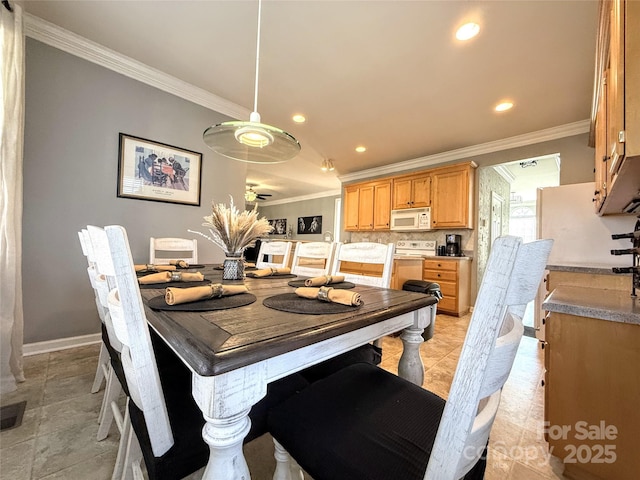 dining area featuring crown molding