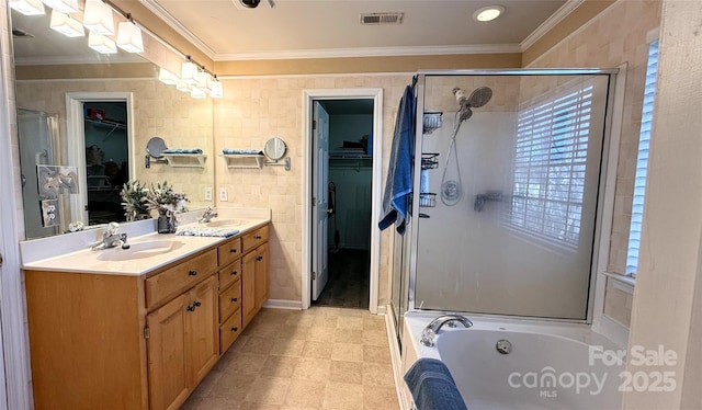 bathroom with crown molding, vanity, and plus walk in shower