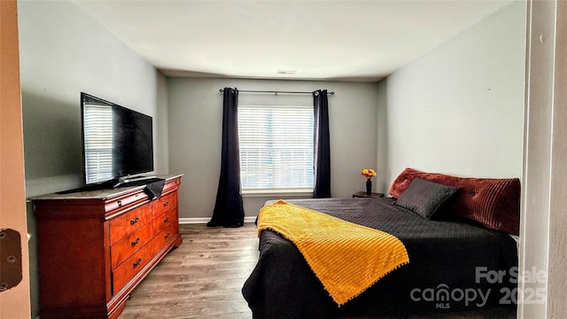 bedroom featuring light hardwood / wood-style floors