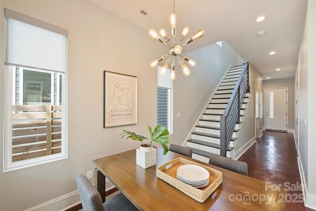 dining space featuring a chandelier