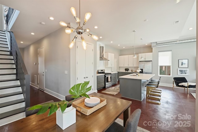 dining area with an inviting chandelier