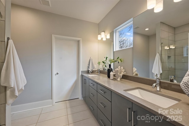 bathroom featuring walk in shower, tile patterned floors, and vanity