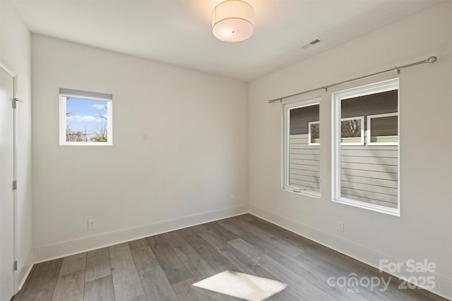 unfurnished room featuring wood-type flooring