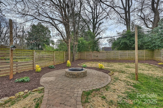 view of yard featuring a fire pit and a patio area