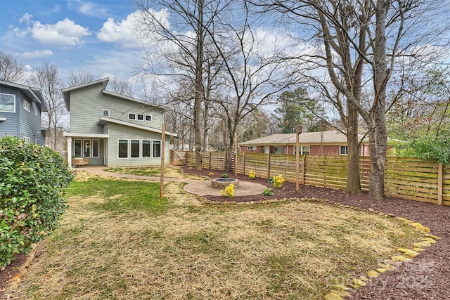 view of yard with an outdoor fire pit