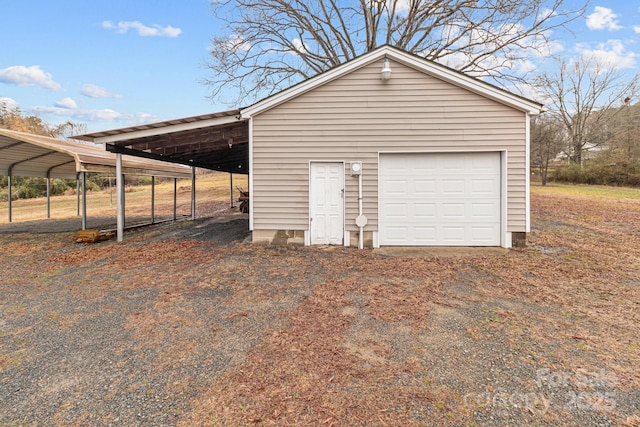 garage featuring a carport