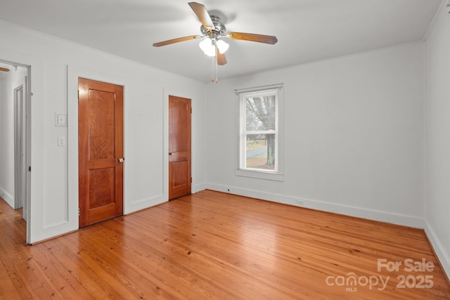 unfurnished bedroom featuring light hardwood / wood-style flooring and ceiling fan