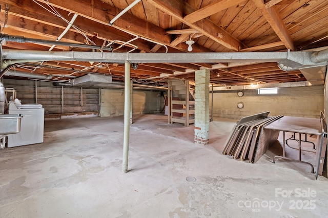 basement featuring separate washer and dryer