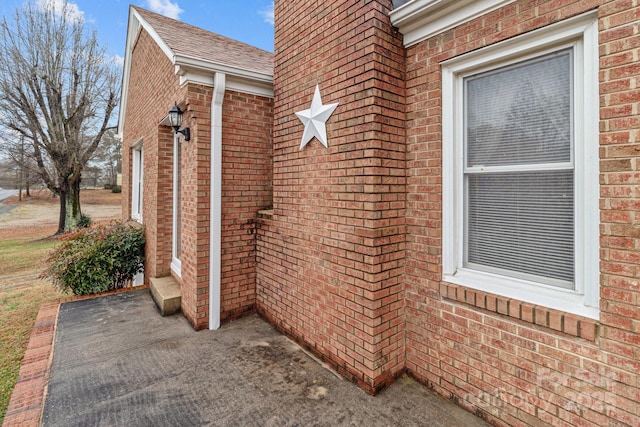 view of side of property featuring a patio area