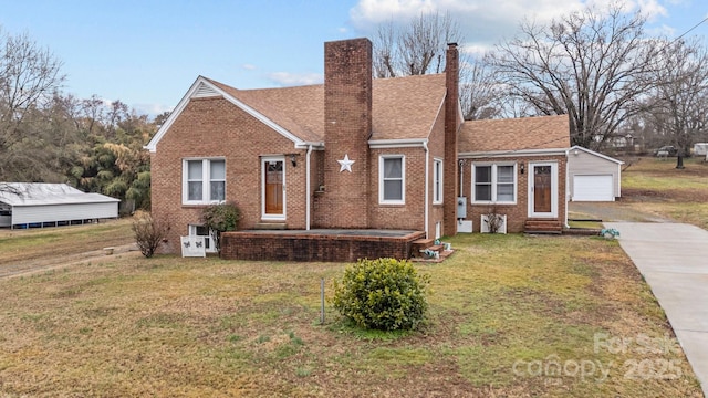 view of front of property with a garage and a front lawn