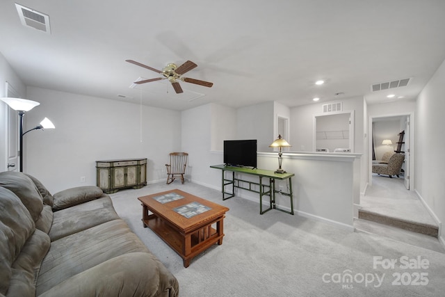 living room with ceiling fan and light carpet