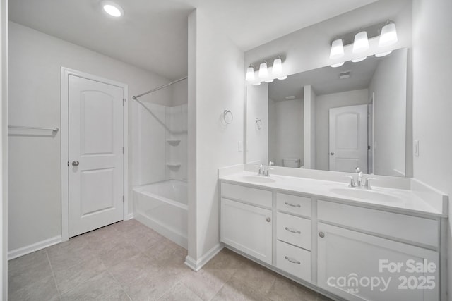 full bathroom with vanity, tile patterned floors, tub / shower combination, and toilet