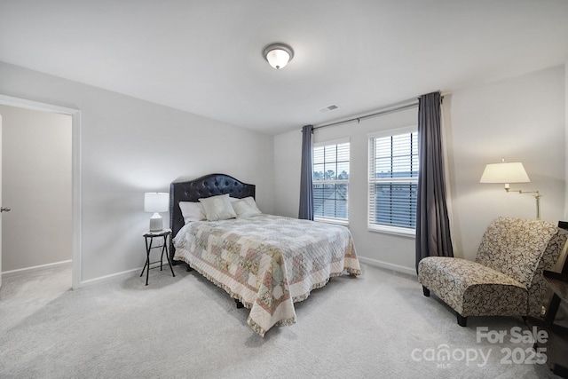 bedroom with a water view and carpet