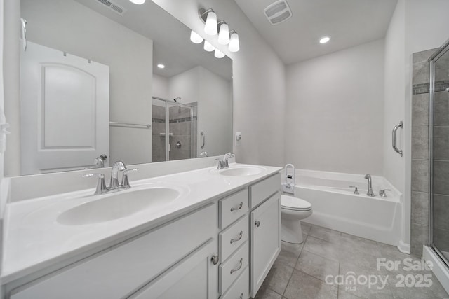 full bathroom featuring tile patterned flooring, vanity, independent shower and bath, and toilet