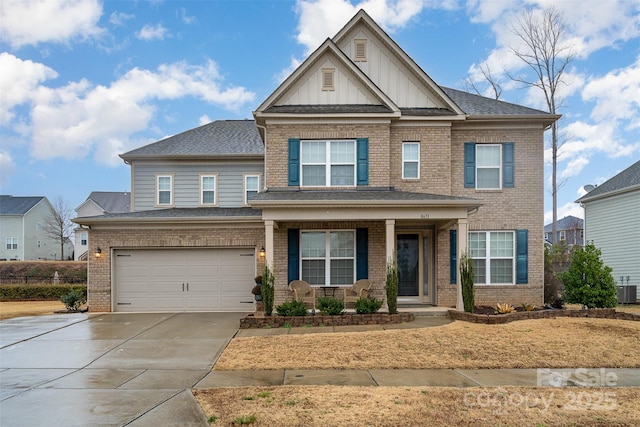 craftsman inspired home featuring a garage and a porch