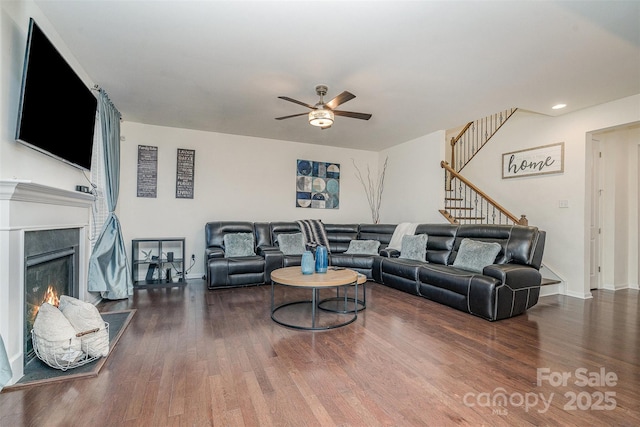 living room with hardwood / wood-style flooring and ceiling fan