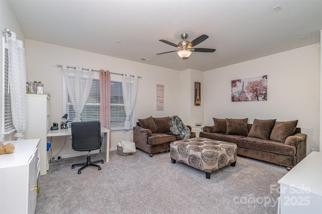 carpeted living room featuring ceiling fan