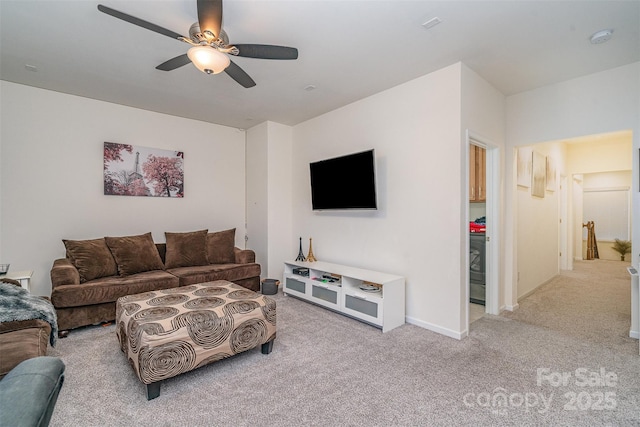 living room featuring light carpet and ceiling fan