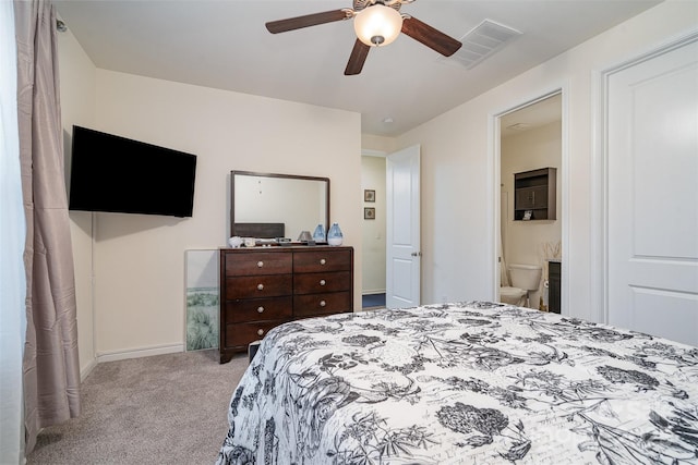carpeted bedroom featuring ceiling fan and ensuite bathroom