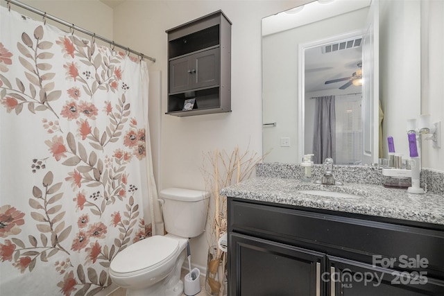 bathroom featuring ceiling fan, vanity, and toilet